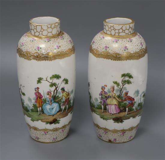 A pair of Dresden Augustus Rex style vases, decorated with ladies and gentlemen